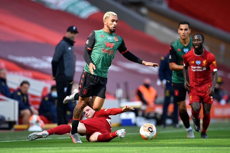  Douglas Luiz of Aston Villa is fouled by Andy Robertson of Liverpool.